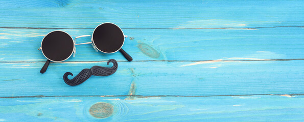 top view image of fathers day composition with vintage father's accessories over blue background