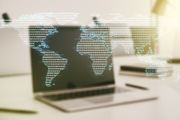 Abstract creative world map on modern laptop background, international trading concept. Multiexposure