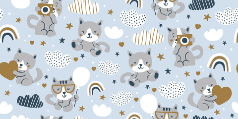 Vector seamless pattern with cute cats, clouds, stars, rainbows isolated on blue background. Nursery pattern design for boys and girls. Cute little cats pattern. Simple minimalistic kids pattern