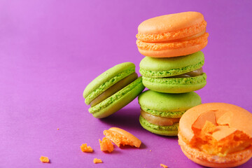 green, yellow,  beige macaroon on a lilac