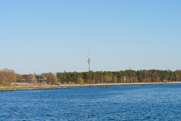 TV tower in Tallinn. View of the sea and forest, sunset