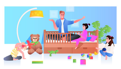 young father playing with little children at home fatherhood parenting concept dad spending time with his kids