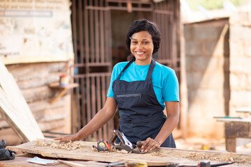 beautiful african carpenter lady in her workshop