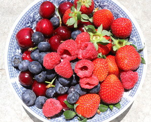 Close up of fresh fruits and berries on daylight