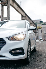 Car's exterior details. shiny headlights on a car