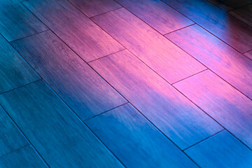parquet dance floor refreshed with colored lights. Disco lights on the floor