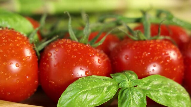 Delicious fresh tomatoes with green basil 