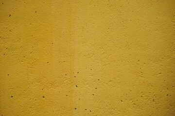 grunge yellow painted cement wall texture