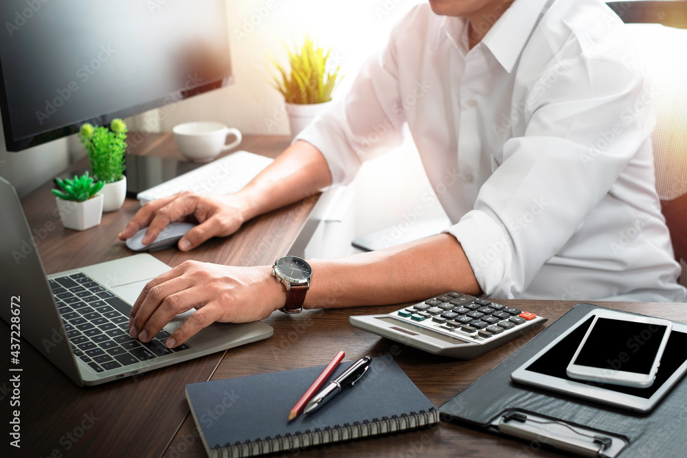 Poster man hands using and typing keyboard of laptop computer on office desk. workspace, businessman workin
