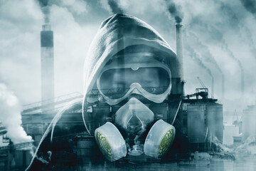 Hooded man in gas mask stands with air pollution