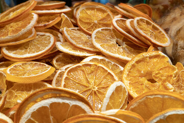 Dried sliced oranges for aromatic warm tea. Top view blur textures soft focus