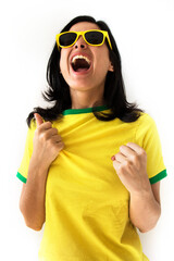Sport fan Cherring. Beautiful brunette girl in yellow uniform. Woman celebrates sports and game over white background.