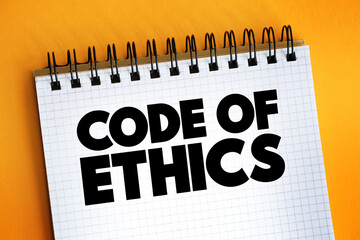Code Of Ethics text quote on notepad, concept background