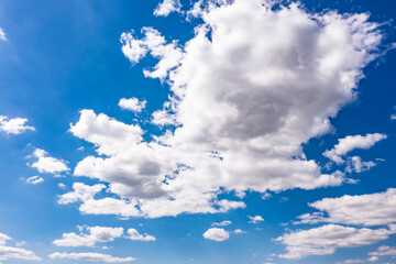 Beautiful blue sky with white clouds, aerial photography of the sky. Sunny day. 