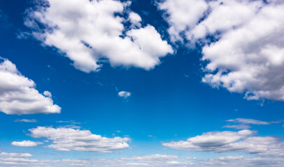 Beautiful blue sky with white clouds, aerial photography of the sky. Sunny day. 