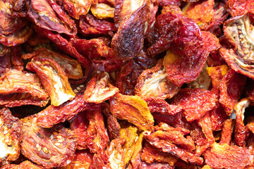 Traditional Italian antipasto dried tomatoes as close-up. Top view blur textures soft focus