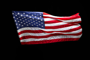 Obraz premium Flag of the USA isolated over dark black background. Memorial Day, Labour Day, Independence Day public holidays.