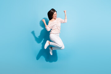 Fototapeta na wymiar Full size photo of excited crazy happy lady jump up air good mood winner isolated on blue color background