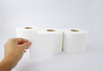 Close-up of toilet paper, tissue paper with a woman's hand holding it, isolated from on White background