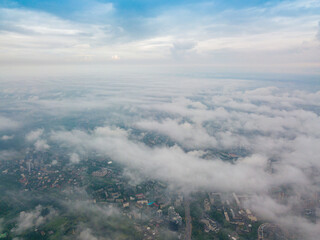Naklejka na ściany i meble High flight above the clouds in Kiev. Spring morning. Aerial high view.