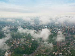 Fototapeta premium High flight above the clouds in Kiev. Spring morning. Aerial high view.