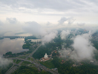 Fototapeta premium High flight above the clouds in Kiev. Spring morning. Aerial high view.