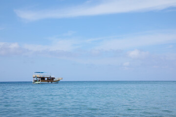 Beautiful view of tranquil sea and boat on sunny summer day