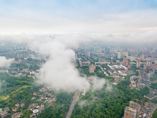 Fototapeta premium High flight above the clouds in Kiev. Spring morning. Aerial high view.