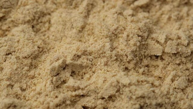 ground ginger close up, rotating. 4K UHD video