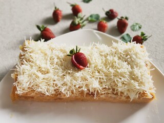 Steamed brownies with cheese and strawberry on top