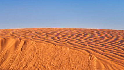 Naklejka premium wind blowing sand over a sand dune in San Rafael Swell area in Utah