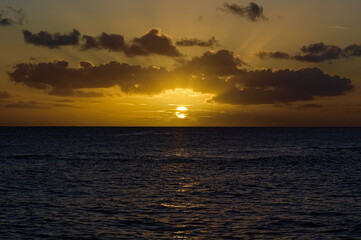 Fototapeta na wymiar Last sunrays of a Caribbean sunset