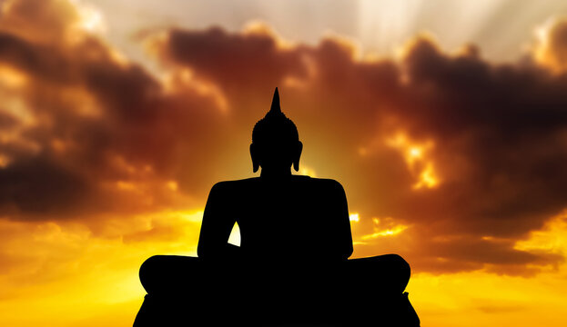 Silhouette giant Buddha with sky background. Believe, Culture, Traditional. Buddhist believe concept. Calm meditation concept. Copy space.