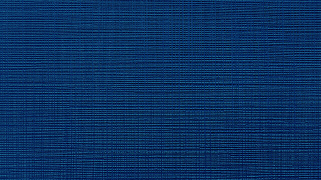 blue textile fabric wallpaper texture background for interior wall covering. grunge canvas fabric background.