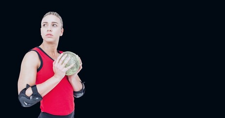 Composition of caucasian female handball player holding ball with copy space on black background