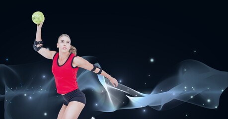 Composition of caucasian female handball player holding ball with copy space on black background
