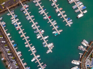 Fototapeta na wymiar Aerial view of boats docked in bay