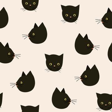 Cute black cat's heads repeated  on pink background . Simple and stylish Scandinavian print.
