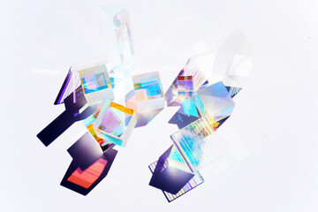 Abstract background with glass geometric figures prisms with light diffraction of spectrum colors...