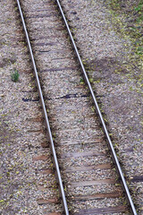 Fototapeta premium Railway bed. Fragment of railway tracks, top view, rails and sleepers.