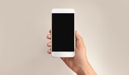 Hand holding smartphone device touching screen