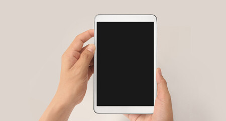 Hands holding tablet touch computer gadget