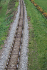 Fototapeta na wymiar Railway bed. Fragment of railway tracks, top view, rails and sleepers.