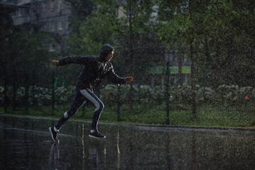 Man jogging under rain, flash light