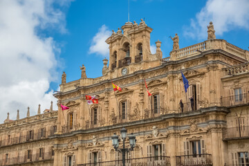 Fototapeta na wymiar View at the baroque facade at the Salamanca City Hall, Ayuntamiento de Salamanca, on Plaza Mayor in Salamanca downtown city