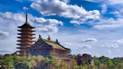 Fototapeta na wymiar Minh Thanh Pagoda. Buddhist temple in Pleiku town. Trees and clouds. Gia Lai. Vietnam. South-East Asia