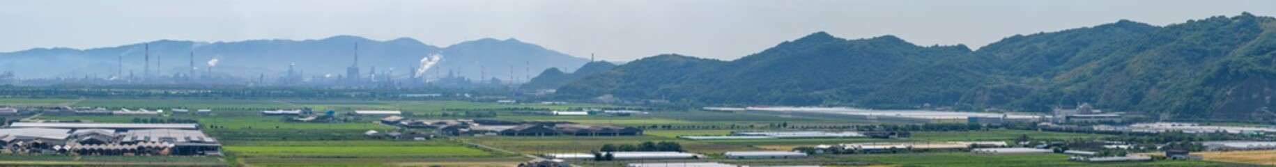 Fototapeta na wymiar Panorama view of reclaimed land and industrial area (Kasaoka City, Okayama Prefecture)