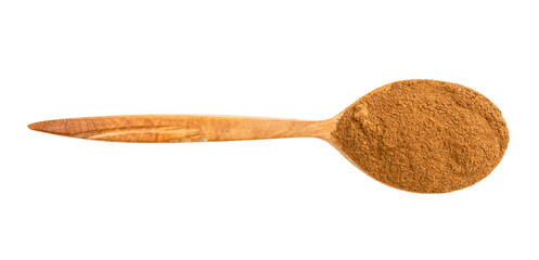 top view of wood spoon with cinnamon powder