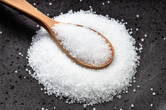 above view of wood spoon with crystalline fructose