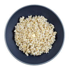 buttered porridge from pearled barley in gray bowl